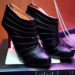 Chistua  Louboutin bootie heels